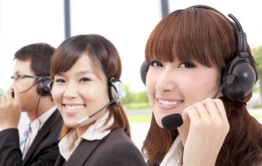 Similing business customer service team on the phone clipart