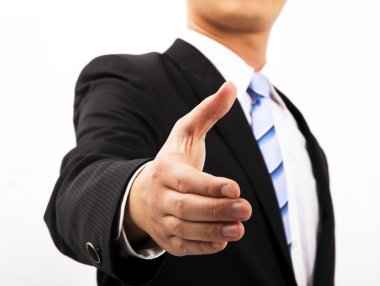 Close up of business man extending hand to shake clipart