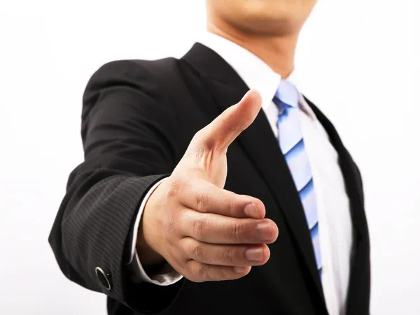 Nahaufnahme eines Geschäftsmannes, der zum Händeschütteln die Hand ausstreckt — Stockfoto