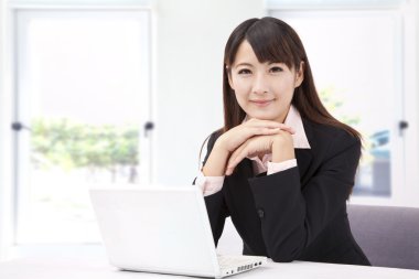Beautiful businesswoman with laptop