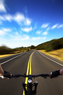 Bicycle rider with high speed view on the road clipart