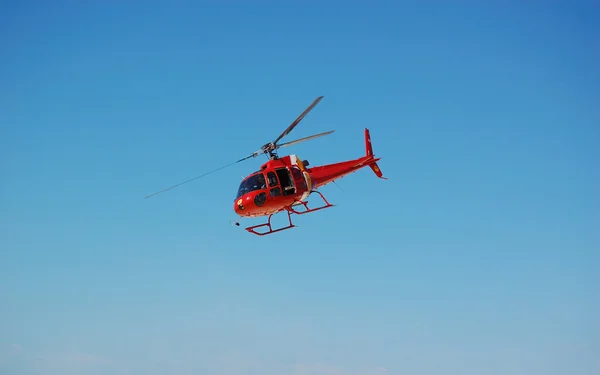 stock image Brazil Coast Guard helicopter flying with blue sky