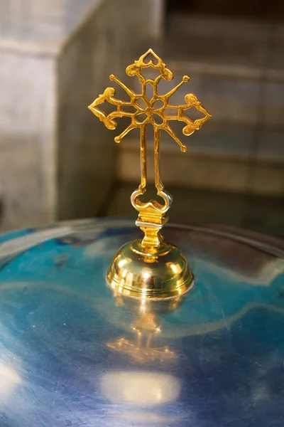 Cross on a church font — Stock Photo, Image