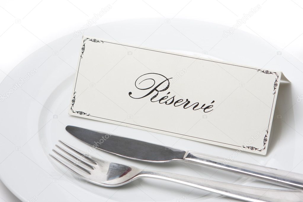 Generic reserved sign on a white plate with fork and knife