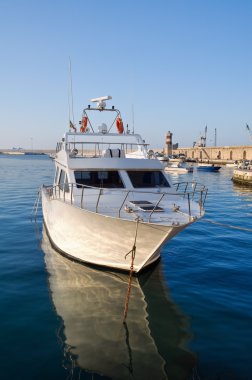 Boat moored at Monopoli port. Apulia. clipart