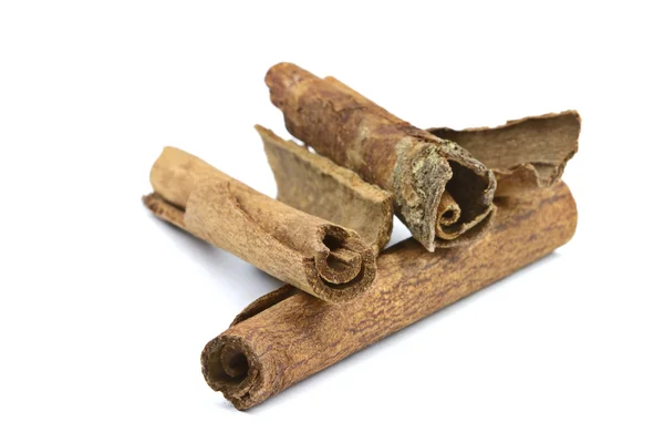 stock image Close-up of cinnamon sticks on white background.