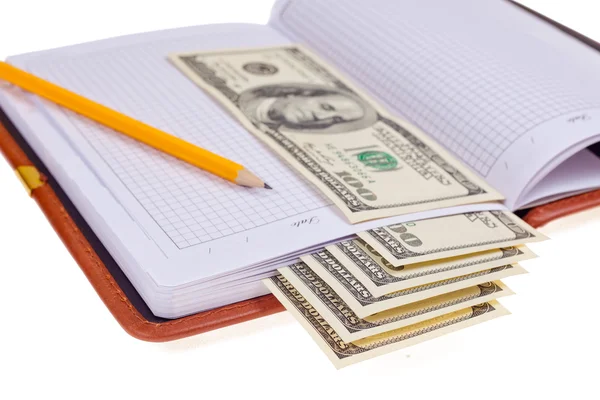 Notebook with money — Stock Photo, Image