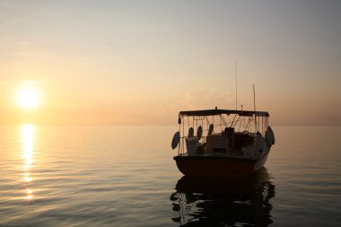 Sunset and the ship in the maldives clipart