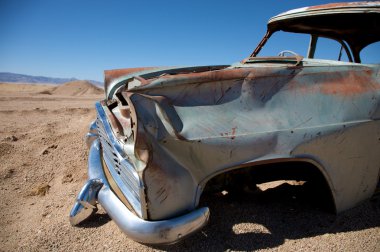 Crashed car in the desert clipart