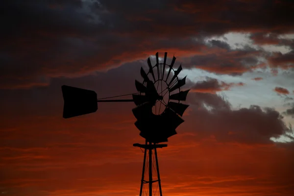 stock image Silhouette of Farm Windmill at Sunset
