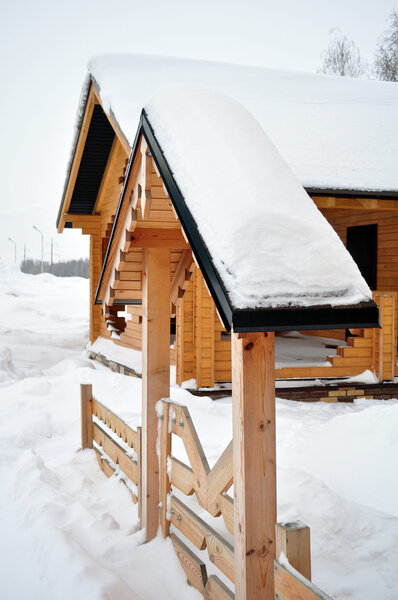 Suburb, front door to the house, winter cabin or a ski chalet, covered with snow, residential structure, building exterior, non-urban scene, residential distric