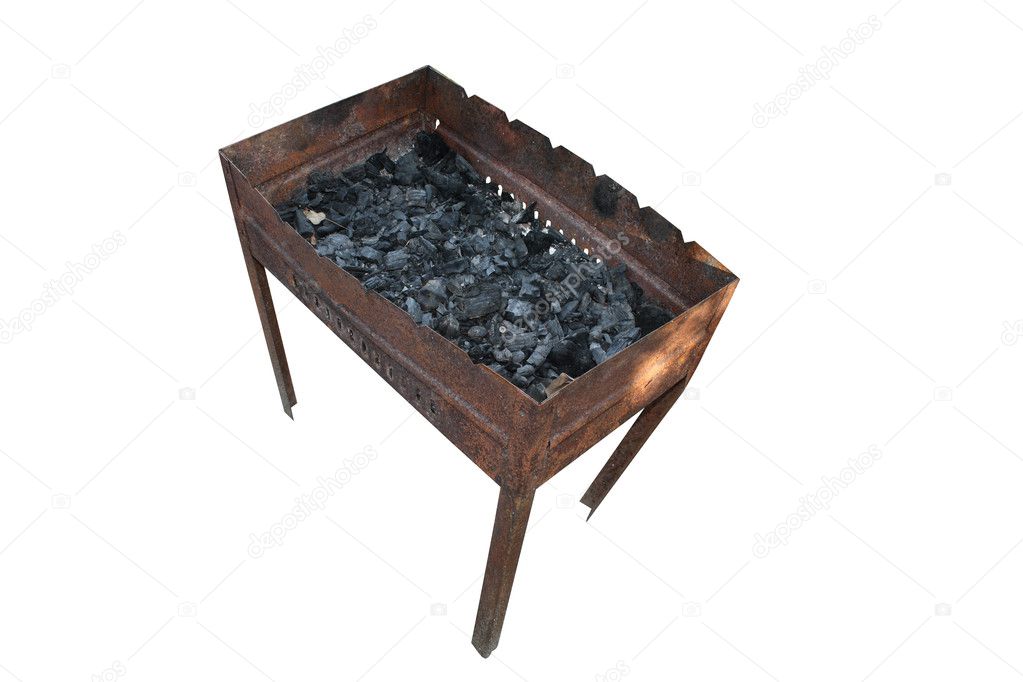 Old rusty barbecue with coals