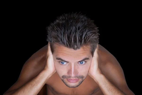 Guy naked torso shut ears against the black background — Stock Photo, Image