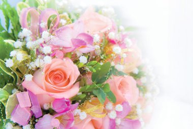 Close photographed the bride's bouquet of roses and other flowers clipart