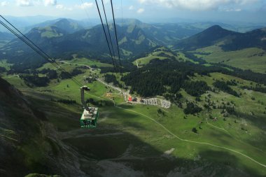 A slow climb to the top of Santis Mountain in Switzerland. clipart