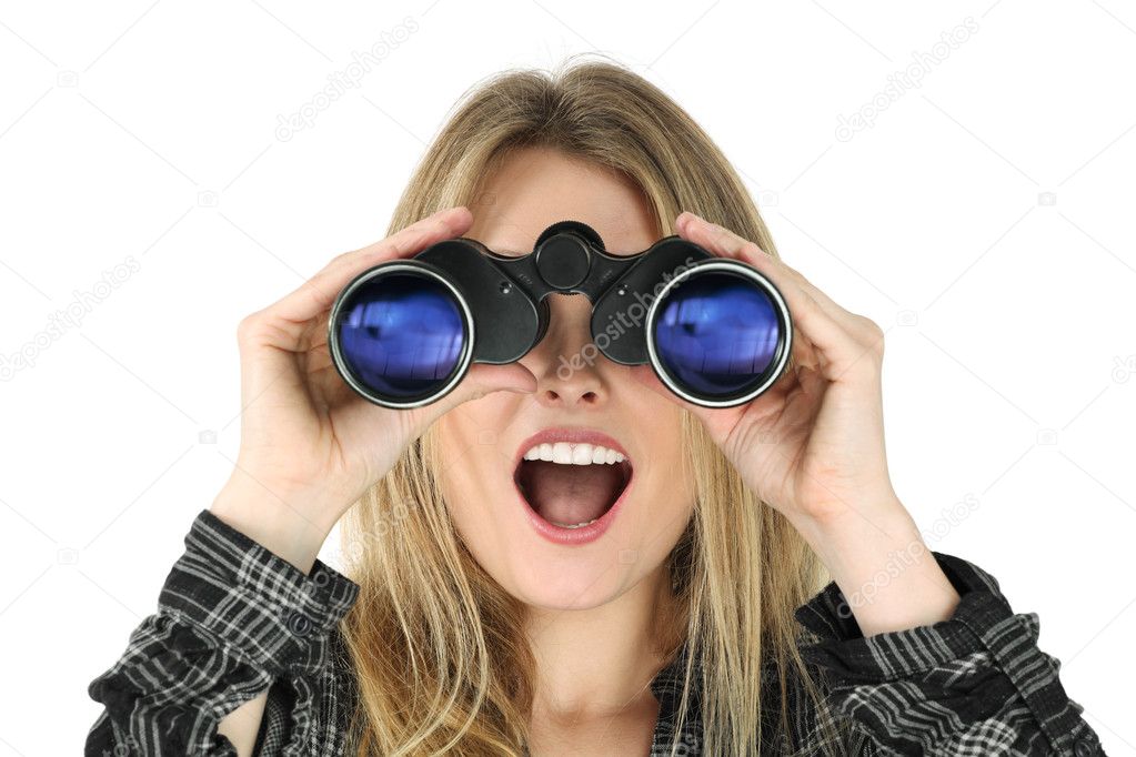 Photo of a beautiful blond woman searching with binoculars and looking surprised.