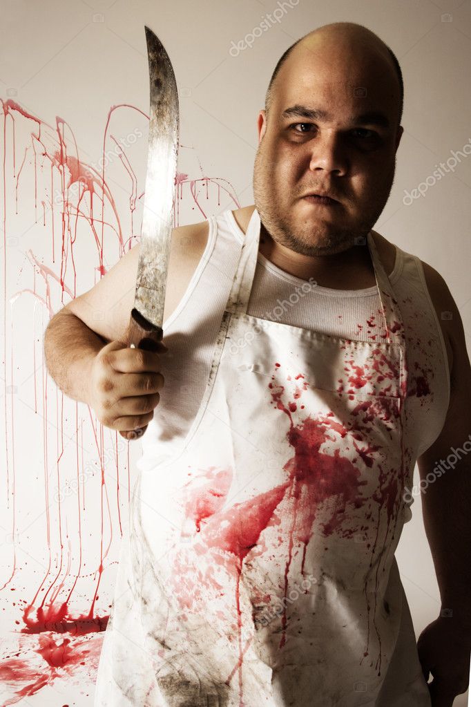 Crazy insane butcher covered with blood. Harsh lighting for more disturbing feel.