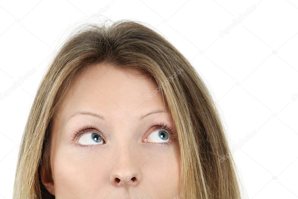 Photo of an attractive blond female looking up at something.