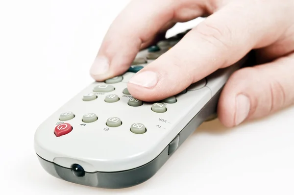 stock image Male hand holding tv remote control