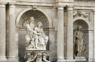 Statues below the Albertina museum in Vienna Austria clipart