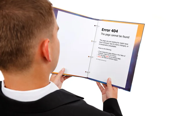 Looking at 404 error page in book — Stock Photo, Image