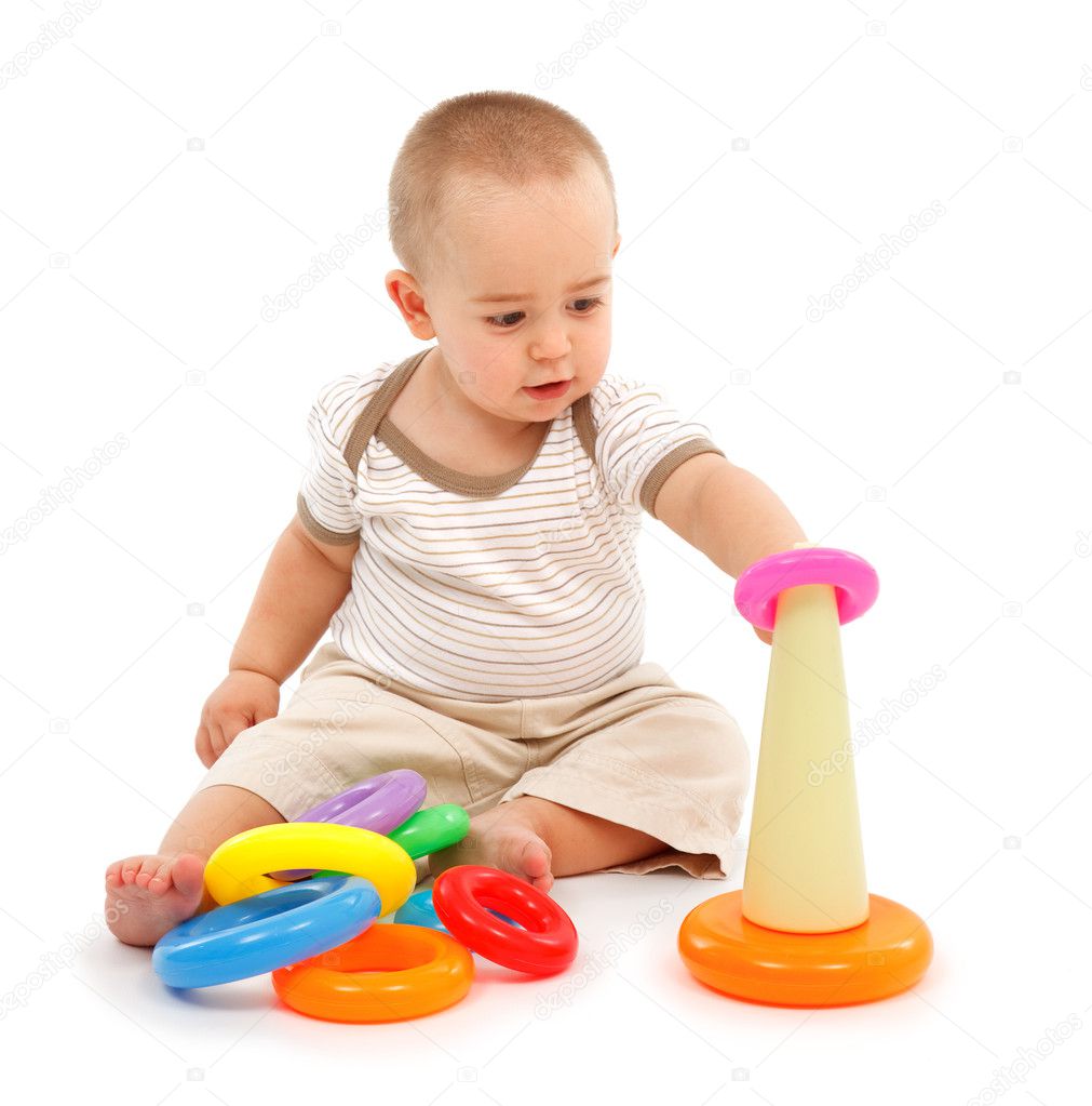 Little boy sitting and playing