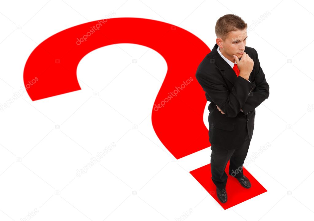 Businessman standing on question mark