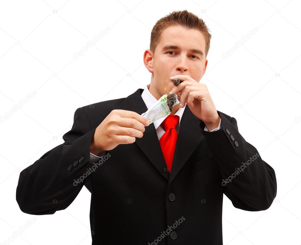 Rich business man lighting cigar