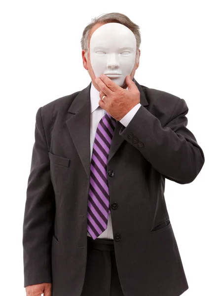 Чоловік прикриває обличчя маскою — стокове фото