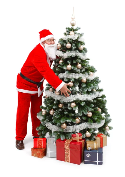Santa claus bedrijf kerstboom — Stockfoto