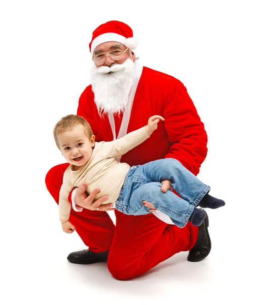 Санта-Клаус с маленьким мальчиком — стоковое фото
