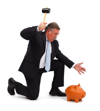 Business man breaking piggy bank clipart