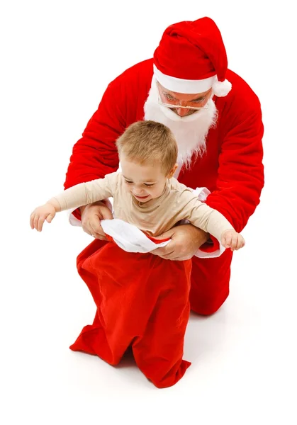 Jongen in Santa Claus de zak — Stockfoto