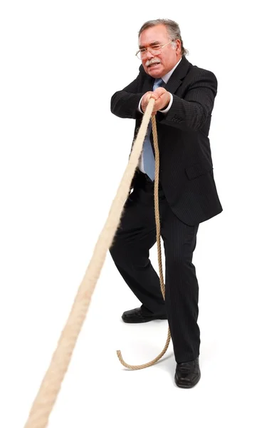 Senior business man dra repet hårt — Stockfoto