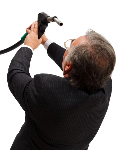 Man looking into gas nozzle — Stock Photo, Image