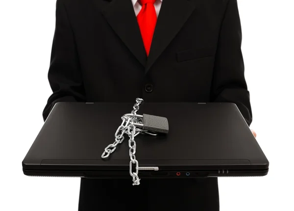 Man holding chained computer — Stock Photo, Image