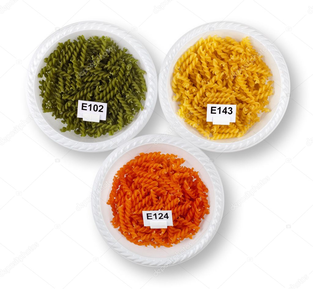 Artificially colored pasta in plates