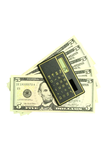 Rekenmachine en dollarbiljetten — Stockfoto
