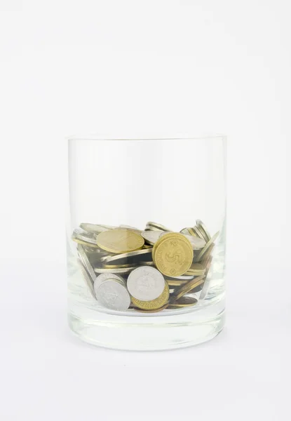 Glas met munten — Stockfoto