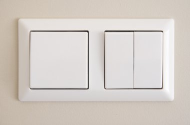 Two light switches on wall clipart