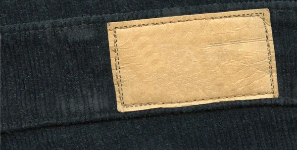 Blank leather label on jeans — Stock Photo, Image