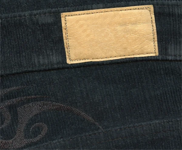 Tom läder etikett på jeans — Stockfoto