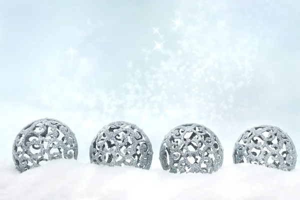 Four silver Christmas ornaments — Stock Photo, Image