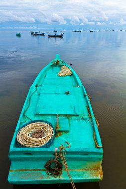 Turqoise fisher boat in Ham Ninh, Phu Quoc, Vietnam clipart