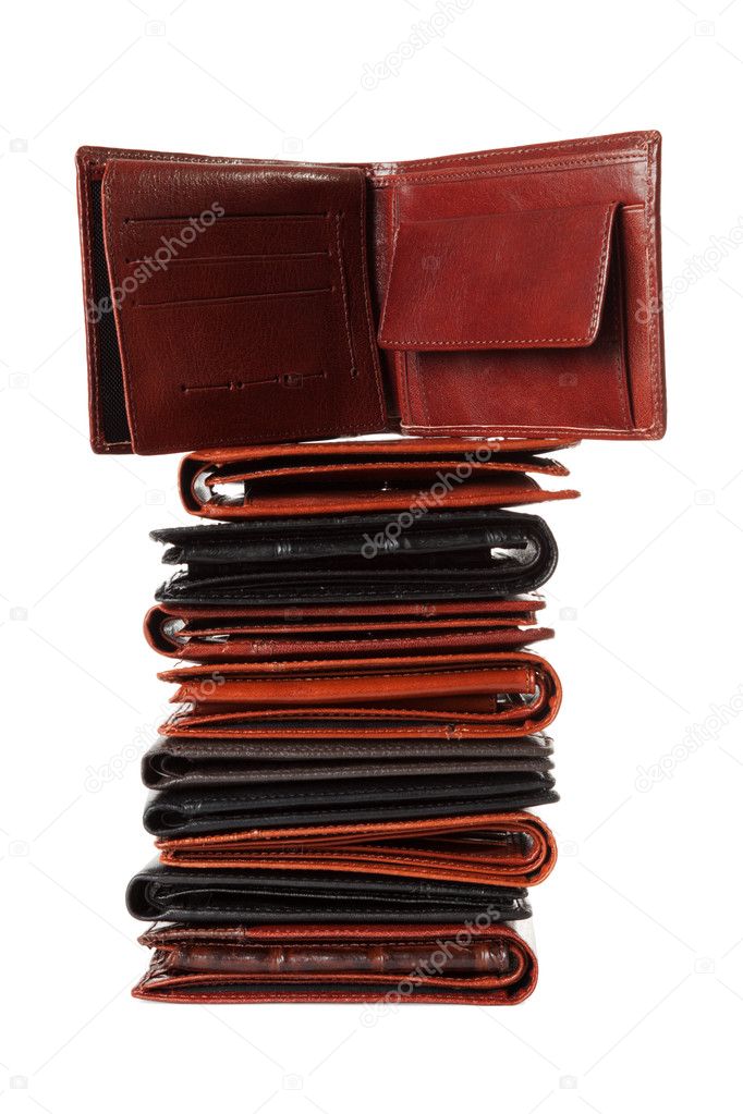 Stack of 10 empty leather wallets isolated over white