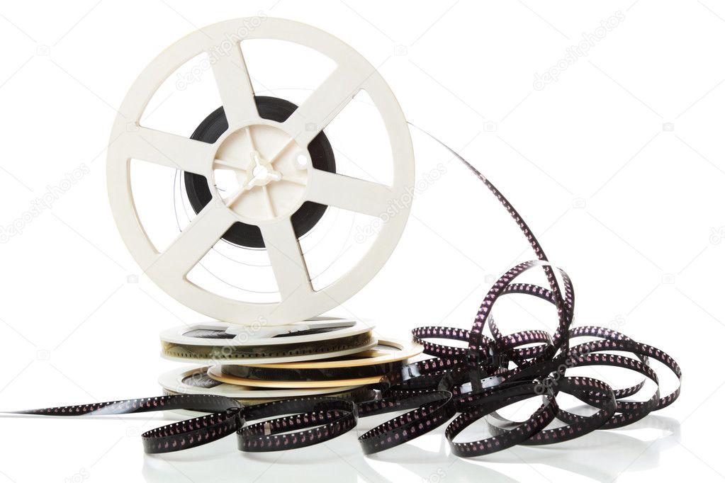 Old 8mm film and stack of canisters isolated over white background