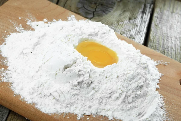 stock image Egg into flour