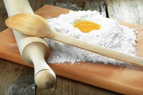 stock image Egg into flour