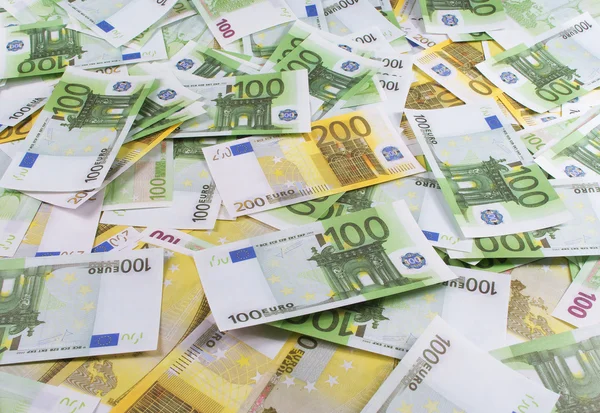 A lot of banknotes one hundred and two hundred euro — Stock Photo, Image