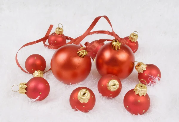 Christmas red spheres on the white fur — Stock Photo, Image